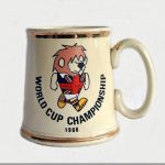 World Cup Willie 1966 Ceramic Tankard: Rare China tankard made by Gibson + Sons of Stoke featuring on one side World Cup Willie with World Cup Championship and official logo the other. Stunning tankard has slight wear on gold rim. Very Good original 50 year old with no repairs or previous damage.